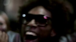 Hip-hop star throws hands in the air surrounded by fans and paparazzi at awards show Stock Footage