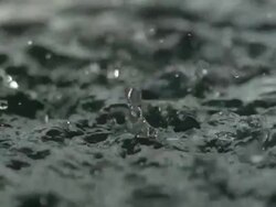 High speed rain falling on water Stock Footage