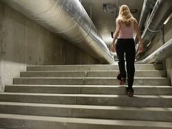 Engineer woman inspecting the underground of a big technical plant Stock Footage