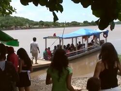 Boat carrying passengers along Beni river, Bolivia, Amazon Stock Footage