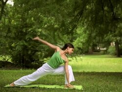Young woman doing yoga exercise Stock Footage
