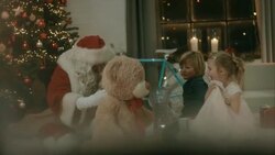 Santa Clause brings presents to kids Stock Footage