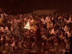 People by the river watching night ritual Stock Footage