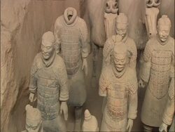 Pan right across Terracotta Warriors and horses, Museum of Qin, Xian, China Stock Footage
