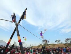 MS LA Shot of tightrope walker doing acrobatics on high wire / Gyeonggido, South Korea Stock Footage