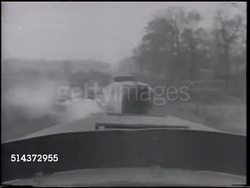 1905: MOVING TRAIN: WS (POV Above cab) Steam train locomotive whistle w/ white steam escaping, SOT blowing twice, TD MS Railroad tracks, HA WS Approaching & entering railway truss bridge over unidentifiable river. Instructional Video