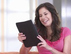 HD: Happy Teenage Girl Chatting On Tablet Stock Footage