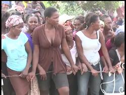 Women are moving to the front of the line at some aid distribution points because charities know that women prepare the food, and the aid groups want to give out enough for numerous meals. News Clip