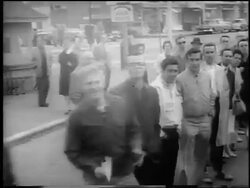 B/W 1962 high angle bus point of view past waving spectators on street during 66th Boston Marathon / newsreel Stock Footage