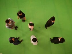 Business people forming alphabet R Stock Footage