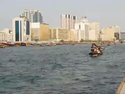 T/L of abra water taxis on Dubai creek, United Arab Emirates Stock Footage
