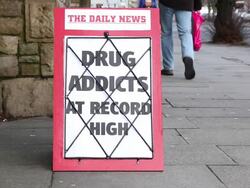 Newspaper Headline board - Drug Addicts at record high Stock Footage