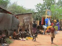 MS Market with Bena tribes selling items and talking in crowded market / Dimeka, Ethiopia Stock Footage