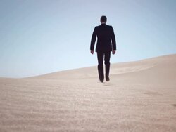 Businessman in desert Stock Footage