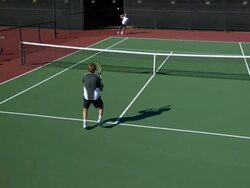 SLO MO, HA, WS, Two young men playing tennis, Santa Barbara, California, USA Stock Footage