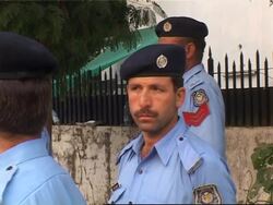 Security outside Bhutto's house, newspaper headlines, voxpops Instructional Video