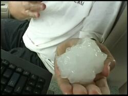 CU Man holding large hail stone to camera, USA Stock Footage