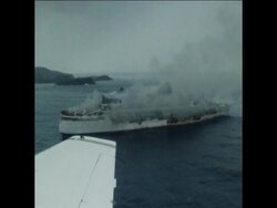 SYND 10/01/71 AERIAL VIEWS OF THE BURNING PASSENGER LINER ANTILLES AGROUND ON A CARIBBEAN REEF News Clip