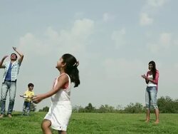 Family flying kite in the park, Delhi, India Stock Footage