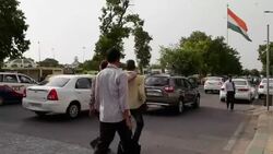 Indian National Flag at the busy central business district of Connaught Place in New Delhi, india Stock Footage