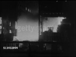 1944: STEEL MILL:  INT WS Molten steel splashing in foundry. LA WS Ladle pouring molten metal in factory. Scrap metal, production, steelworks, metals Instructional Video