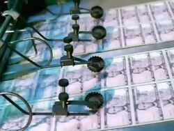 CU, Sheets of American five dollar bills moving fast on conveyor, Washington DC, USA Stock Footage