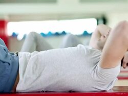Sit-ups in a gym Stock Footage