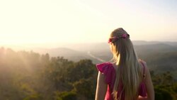 Young boho girl looking at mountains Stock Footage