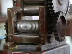 Goldsmith Jeweler rolled silver metal Stock Footage