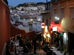 People eating outside Lisbon restaurant at dusk Bairro alto, Lisbon, Portugal, Europe Stock Footage