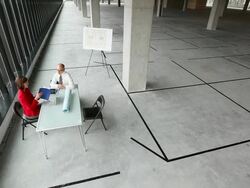 WS View of Two business people meeting at table in unfinishing office space finish up shake hands and exit to the right / Seattle, Washington, United States Stock Footage