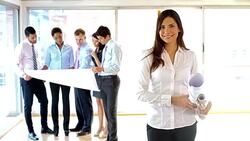 Architect at the office holding blueprints Stock Footage