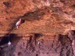 WS PAN ZI View of male climber climbing crack upside down / Moab, Utah, United States Stock Footage