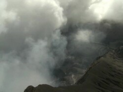 Clouds of volcanic gas rise from giant crater at Marum volcano, Ambrym Island, Vanuatu Stock Footage