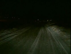 POV moving car on snowy road at night Stock Footage