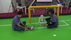 CLEAN : Sanctions hit Iran triumphs in footballs RoboCup News Clip