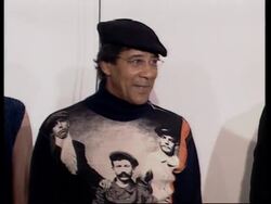 Working class hero flexes his muscle on the catwalk News Clip