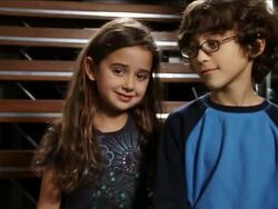 MS Curly haired girl and kid with glasses hugging each other and smiling / Miami, Florida, United States  Stock Footage