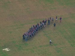 MS AERIAL Shot of girls rugby player shake hands after game at Citadel military college / South Carolina, United States Stock Footage
