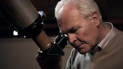 Old man with telescope Stock Footage