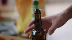 Man grabbing beer bottle Stock Footage