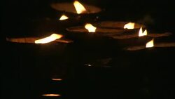 Diyas flicker as they float on a river during India's Diwali celebration. Stock Footage