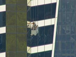 WS AERIAL ZI ZO View of window cleaners on Eureka tower / Melbourne, Victoria, Australia Stock Footage