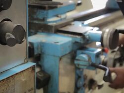 Worker on a Lathe machine Stock Footage