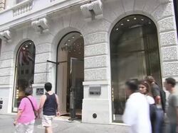 MS, Pedestrians passing by Versace store window displays, New York City, New York, USA Stock Footage