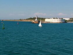 sailing yacht on the background of an old fort Stock Footage
