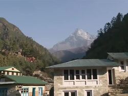 WS ZI Sherpa village Monjo with holy Mountain Khumbi Yul Lha peak / Monjo, Khumbu Region, Nepal Stock Footage