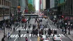 Pedestrians cross 42nd Street in Midtown Manhattan. Stock Footage