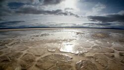 Dry, cracked earth and clouds Stock Footage