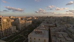 Mellow sunlight and shadows fall across the city of Alexandria, Egypt. Stock Footage